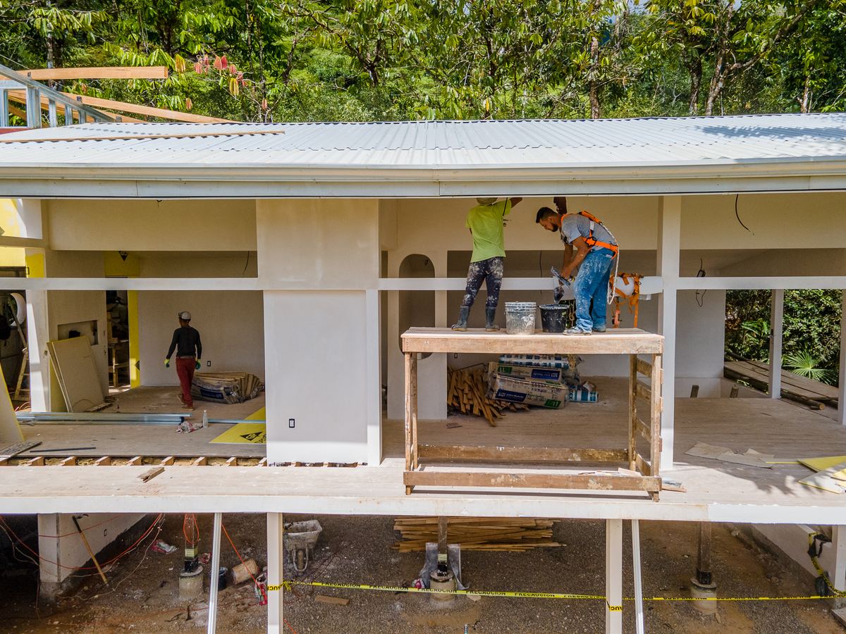 Quality Homes By The Black Sheep construction team on site in Costa Rica — active project management